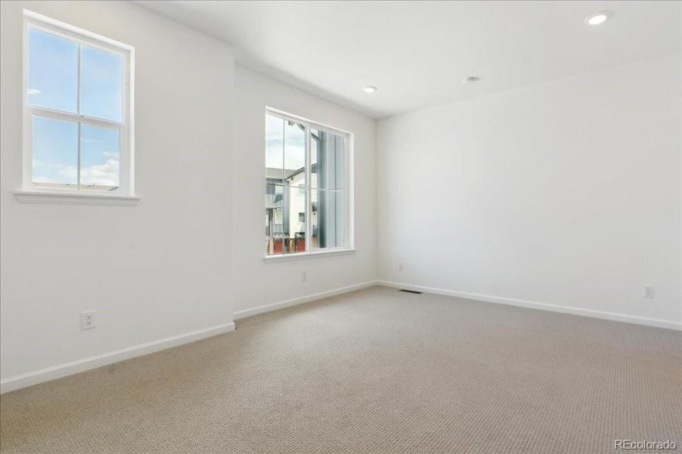 6800 Merseyside Lane, Unit 166 Castle Pines, CO 80108 - Photo 9 of 21 an empty room with windows