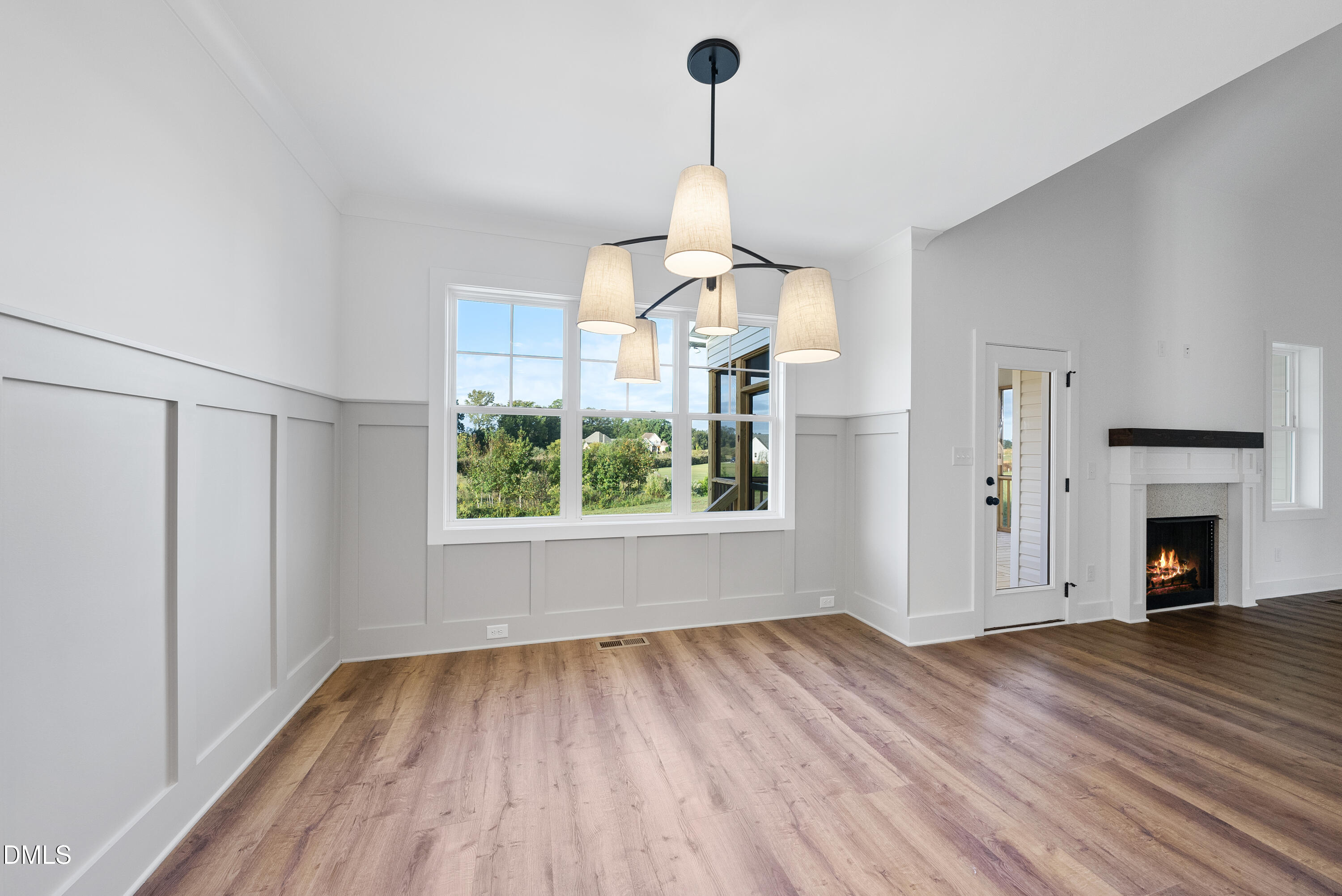 4 Arthur Wilder Road Spring Hope, NC 27882 - Photo 5 of 8 a view of empty room with wooden floor and fireplace