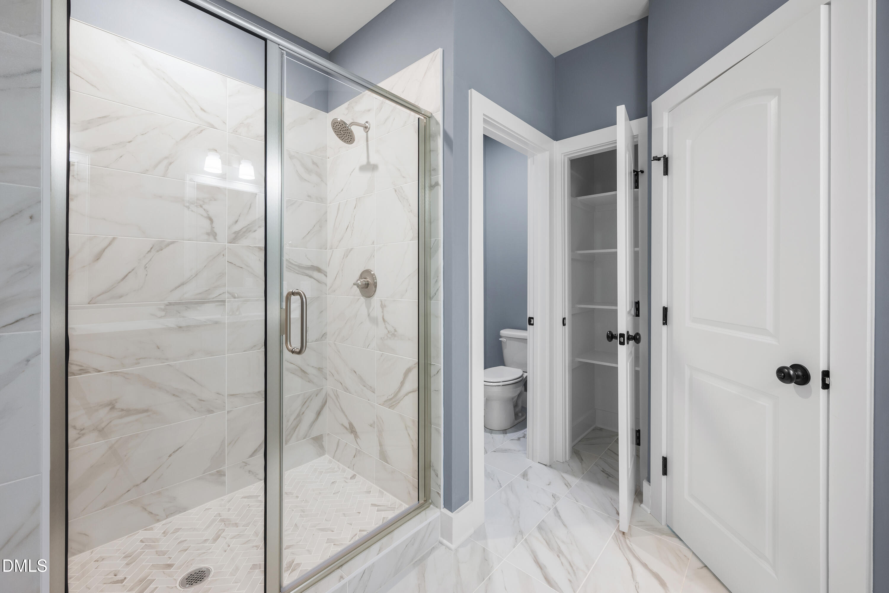 4 Arthur Wilder Road Spring Hope, NC 27882 - Photo 7 of 8 a bathroom with a glass shower door