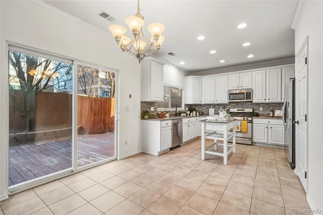 a bathroom with a sink vanity mirror and toilet