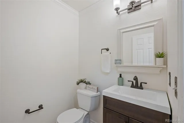 an empty room with a window and a ceiling fan