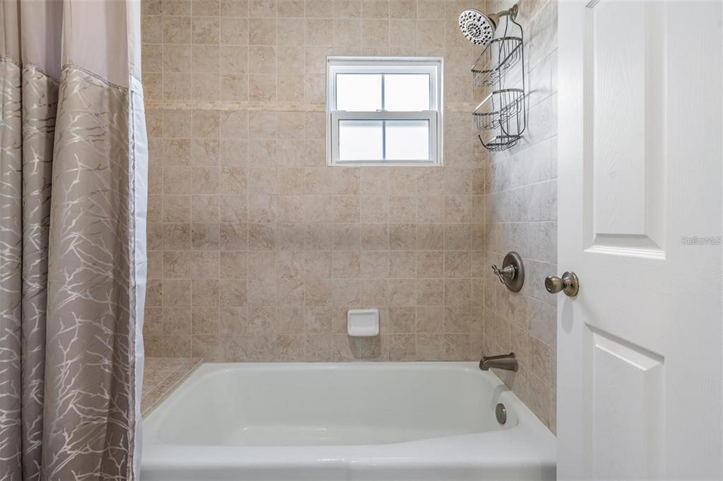 701 Poinsettia Road, Unit 248 Belleair, FL 33756 - Photo 21 of 38 a bathroom with a bathtub