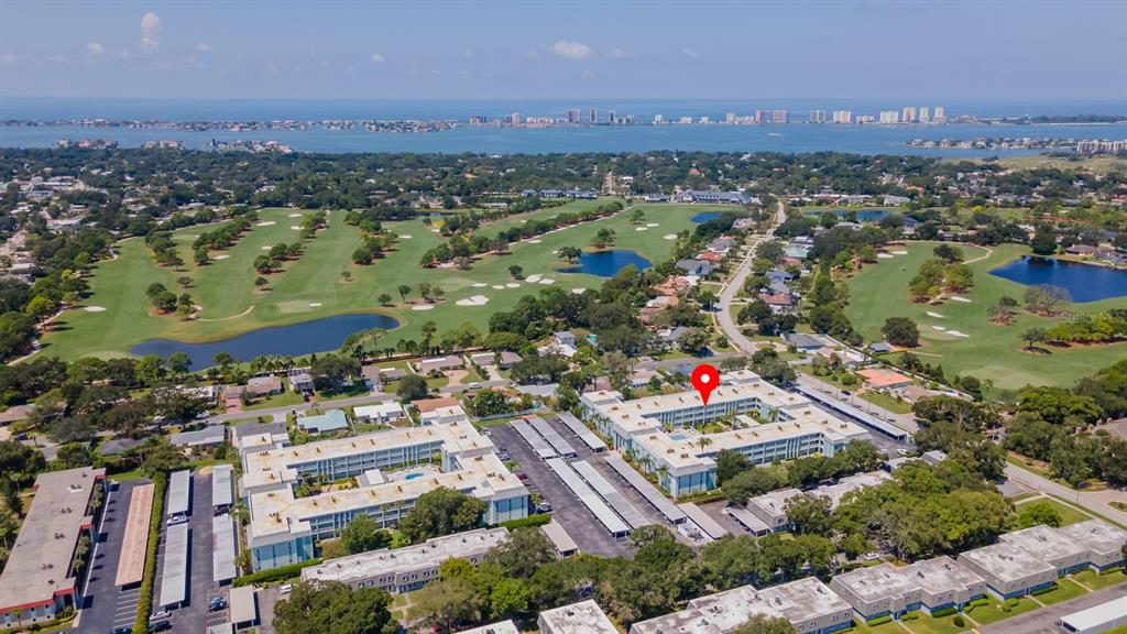 701 Poinsettia Road, Unit 248 Belleair, FL 33756 - Photo 30 of 38 an aerial view of residential houses with outdoor space