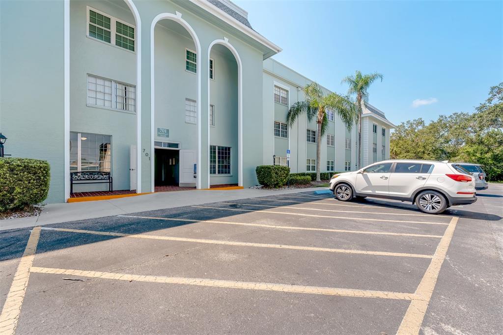 701 Poinsettia Road, Unit 248 Belleair, FL 33756 - Photo 34 of 38 a view of a car parked in front of a building