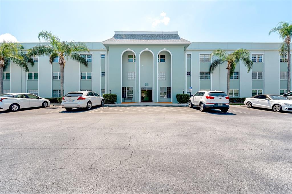 701 Poinsettia Road, Unit 248 Belleair, FL 33756 - Photo 35 of 38 a cars parked in front of a building