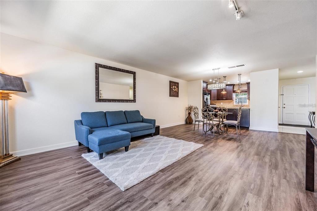 701 Poinsettia Road, Unit 248 Belleair, FL 33756 - Photo 8 of 38 a living room with furniture and wooden floor