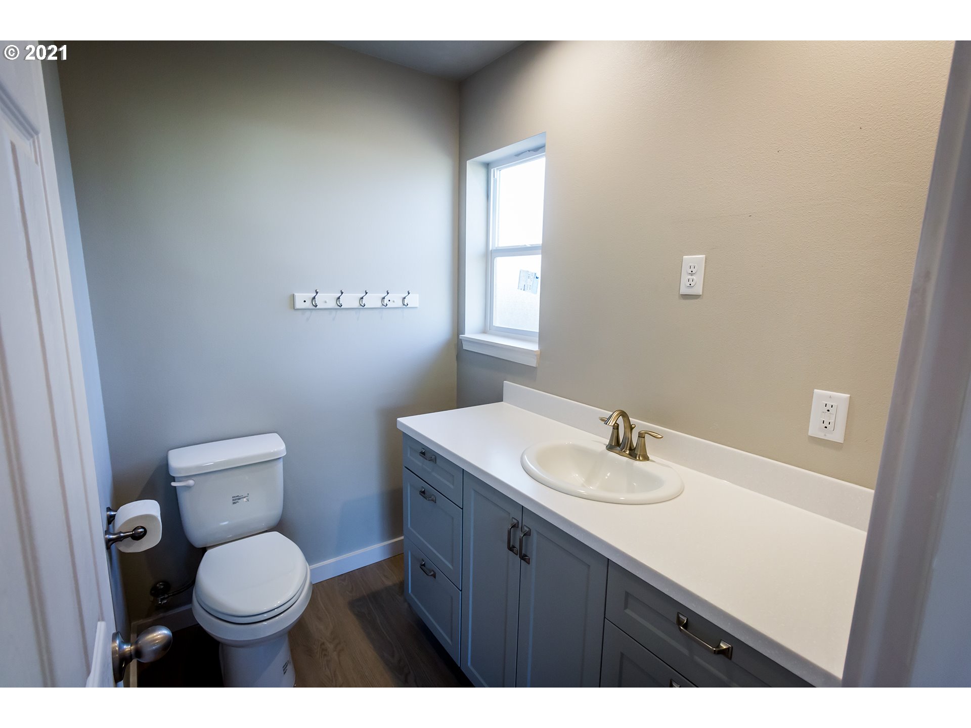 170 65th Place Springfield, OR 97478 - Photo 22 of 28 a bathroom with a granite countertop toilet sink and mirror