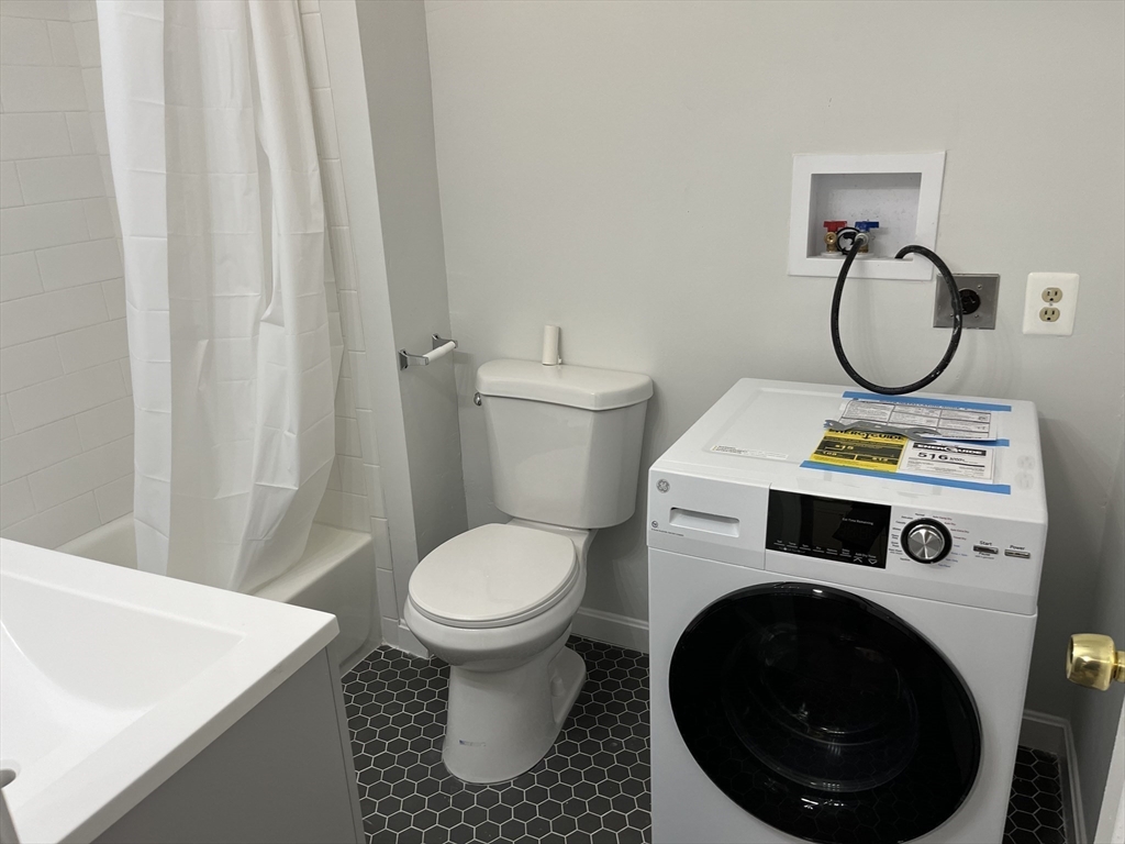 5 State Street, Unit 4F Worcester, MA 01609 - Photo 7 of 9 a bathroom with a sink toilet and a shower