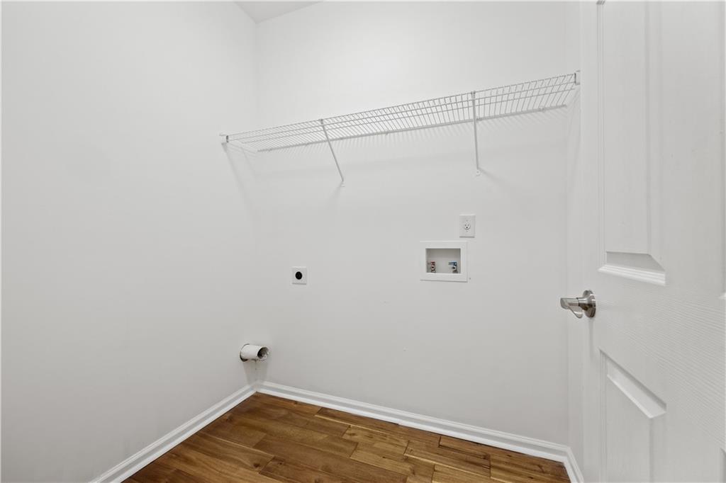1549 Stewart Ridge Drive Buford, GA 30518 - Photo 11 of 32 a view of a room with wooden floor