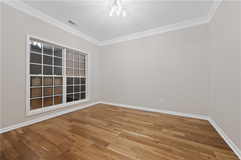 1549 Stewart Ridge Drive Buford, GA 30518 - Photo 2 of 32 an empty room with windows