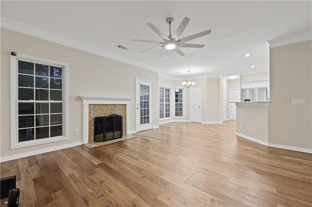 1549 Stewart Ridge Drive Buford, GA 30518 - Photo 7 of 32 a view of an empty room with a window and fireplace