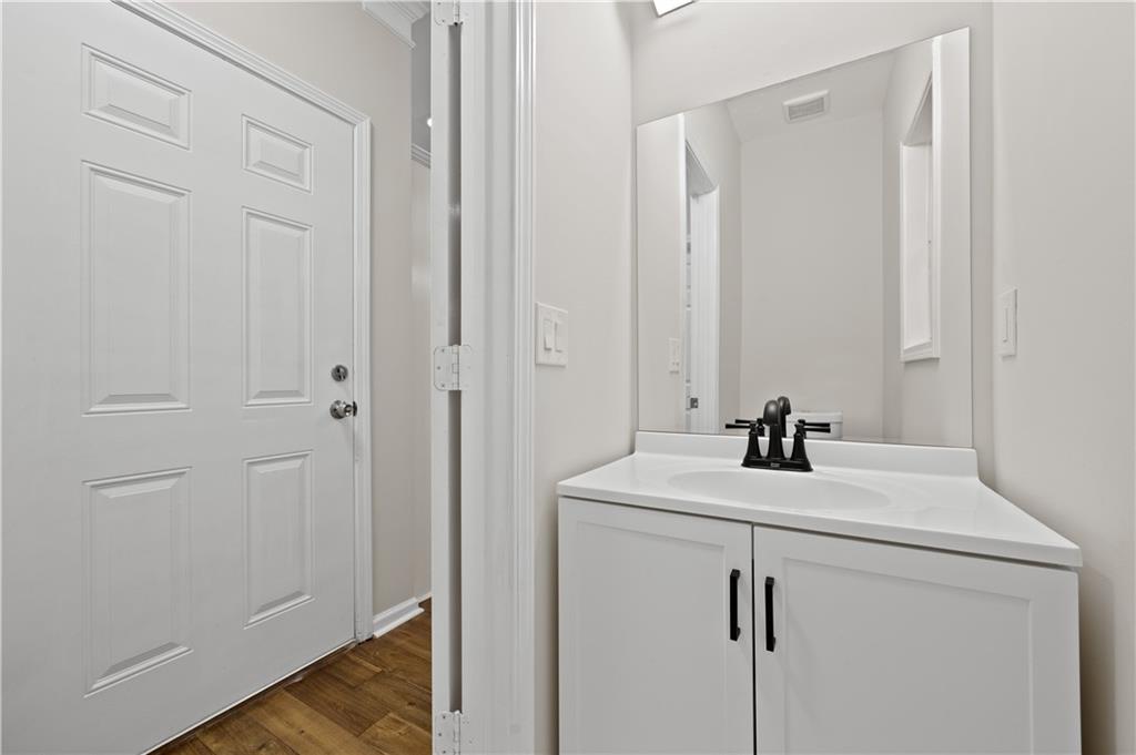 1549 Stewart Ridge Drive Buford, GA 30518 - Photo 10 of 32 a bathroom with a sink and vanity