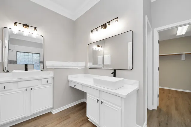 a bathroom with a granite countertop shower