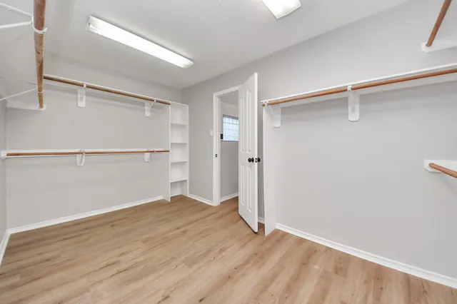 a bathroom with a toilet sink and a mirror