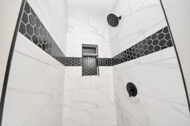 an empty room with a empty space and a ceiling fan