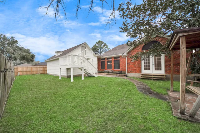 a view of two chairs in the patio