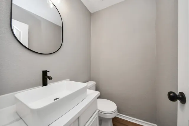 a bathroom with a toilet and a sink