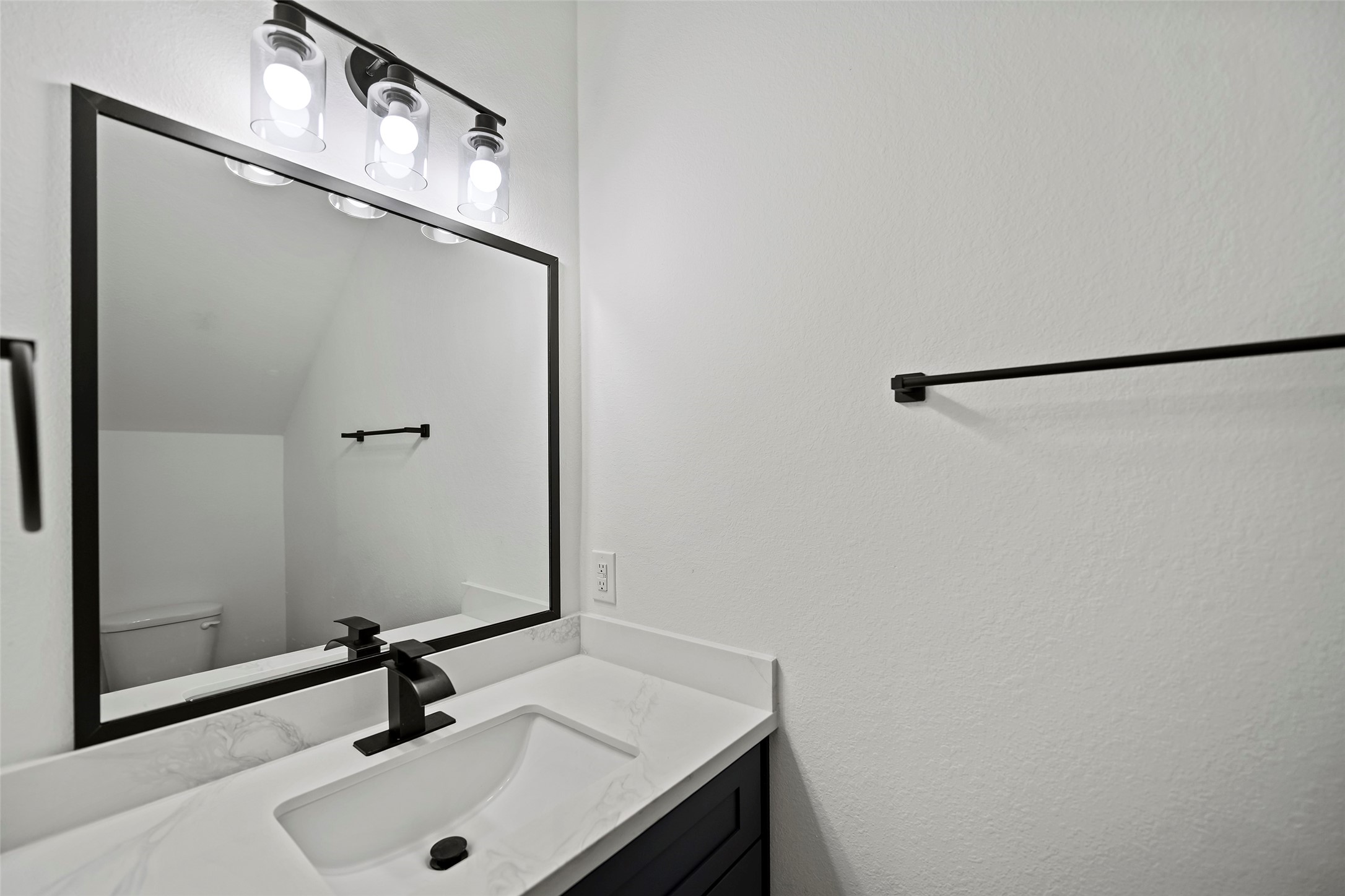 1071 St Clair Street Houston, TX 77088 - Photo 12 of 31 a bathroom with a sink and a mirror