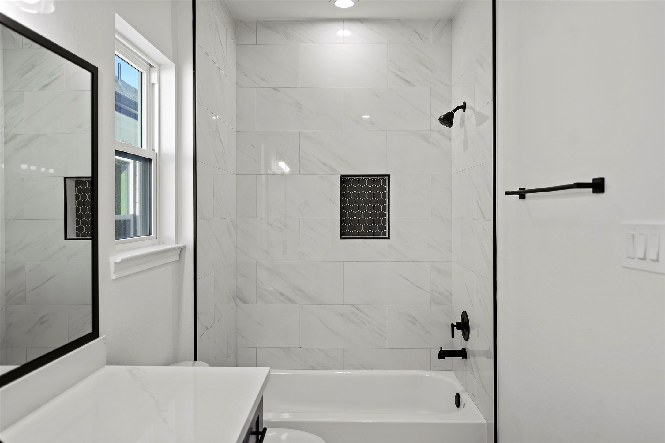 1071 St Clair Street Houston, TX 77088 - Photo 21 of 31 a bathroom with a bathtub and shower