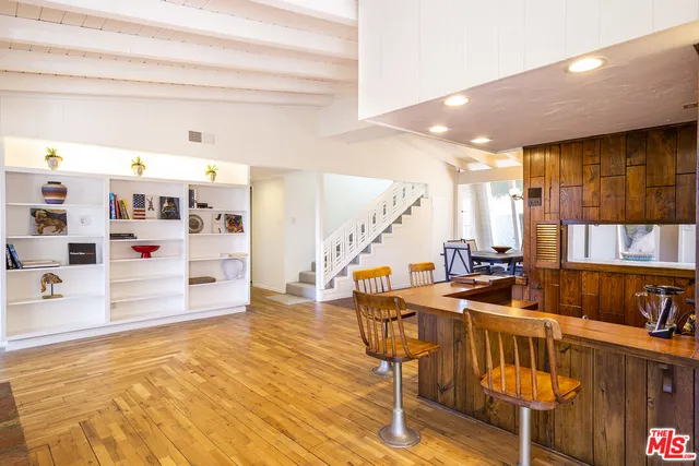 a kitchen with stainless steel appliances kitchen island granite countertop a sink and cabinets