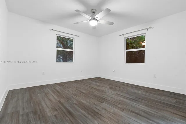 a bathroom with 2 sink and a mirror