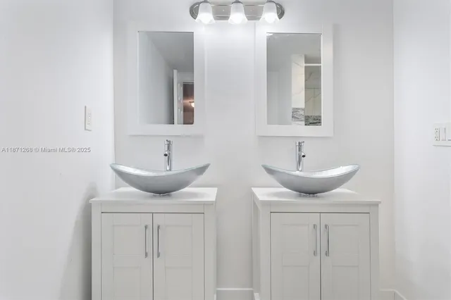 a bathroom with a sink and shower