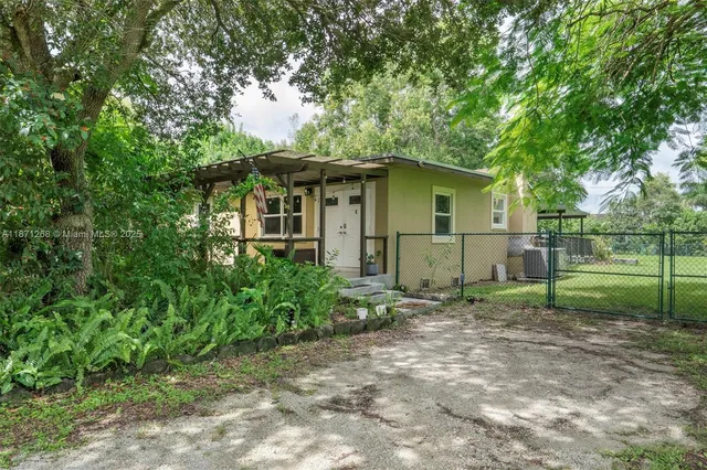 a view of a park with large trees