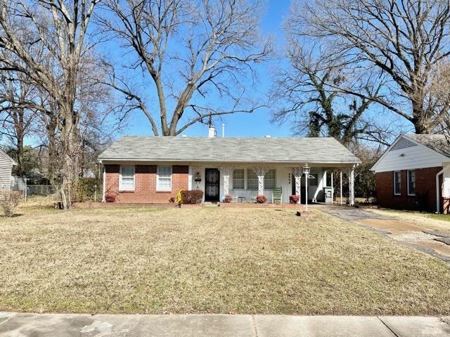 4468 Garnett Road Memphis, TN 38117 - Photo 1 of 14 a front view of a house with a yard