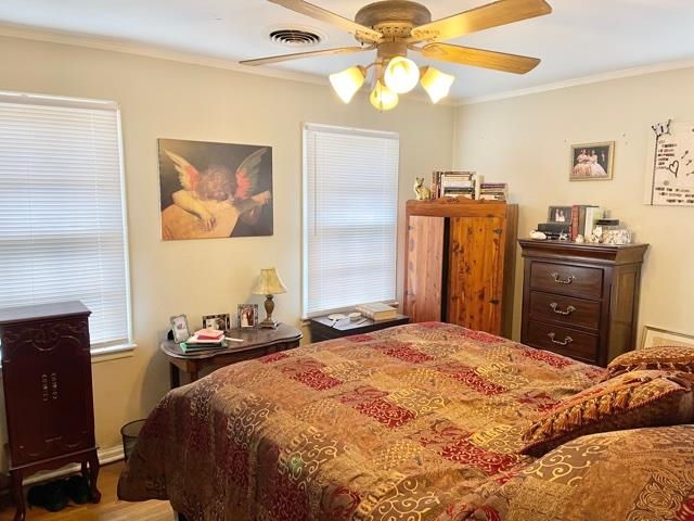 4468 Garnett Road Memphis, TN 38117 - Photo 7 of 14 a bedroom with a bed and a chandelier