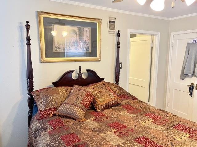 4468 Garnett Road Memphis, TN 38117 - Photo 8 of 14 a bedroom with a bed and a painting on the wall