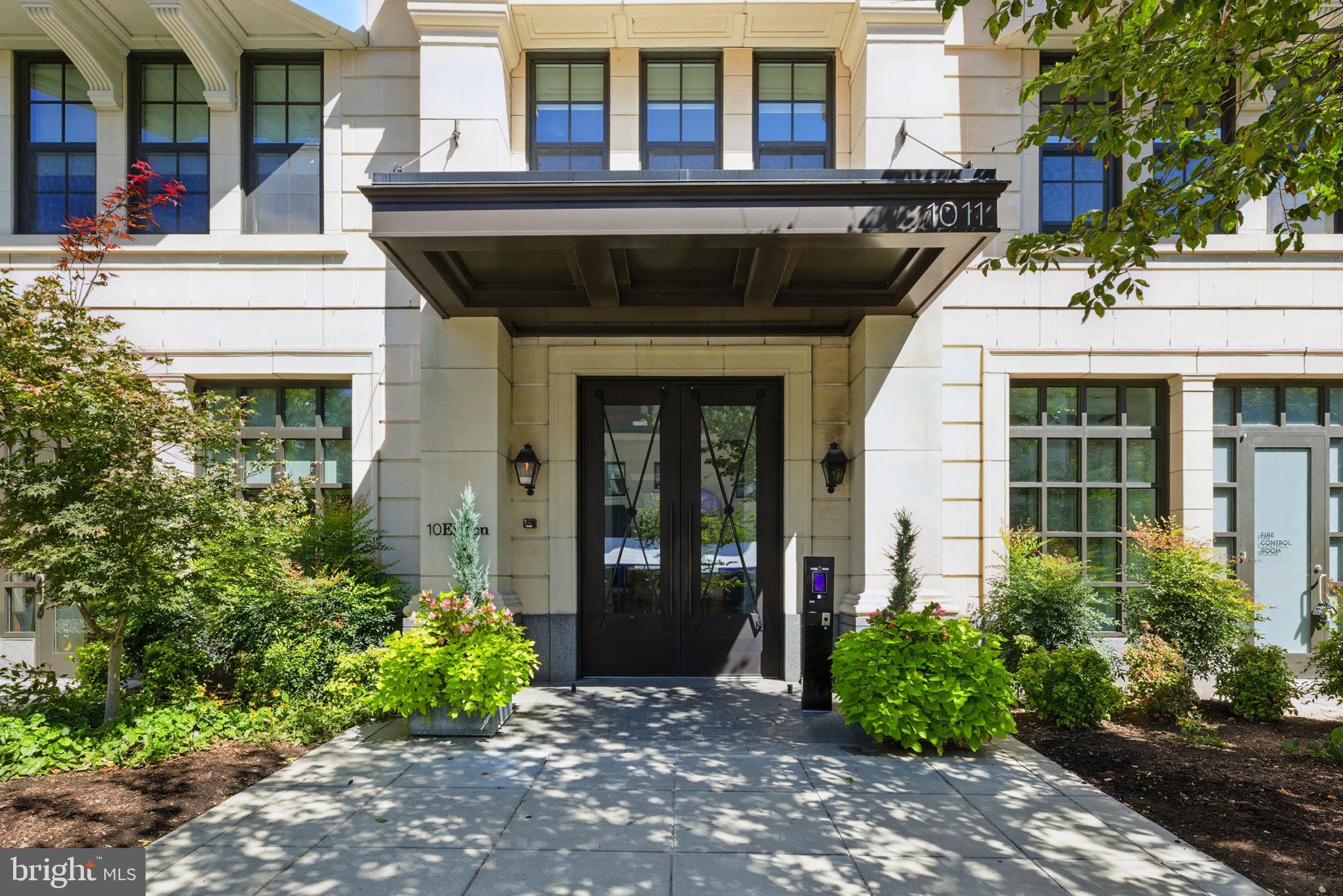 1011 M Street Northwest, Unit 901 Washington, DC 20001 - Photo 2 of 26 a front view of a building with garden