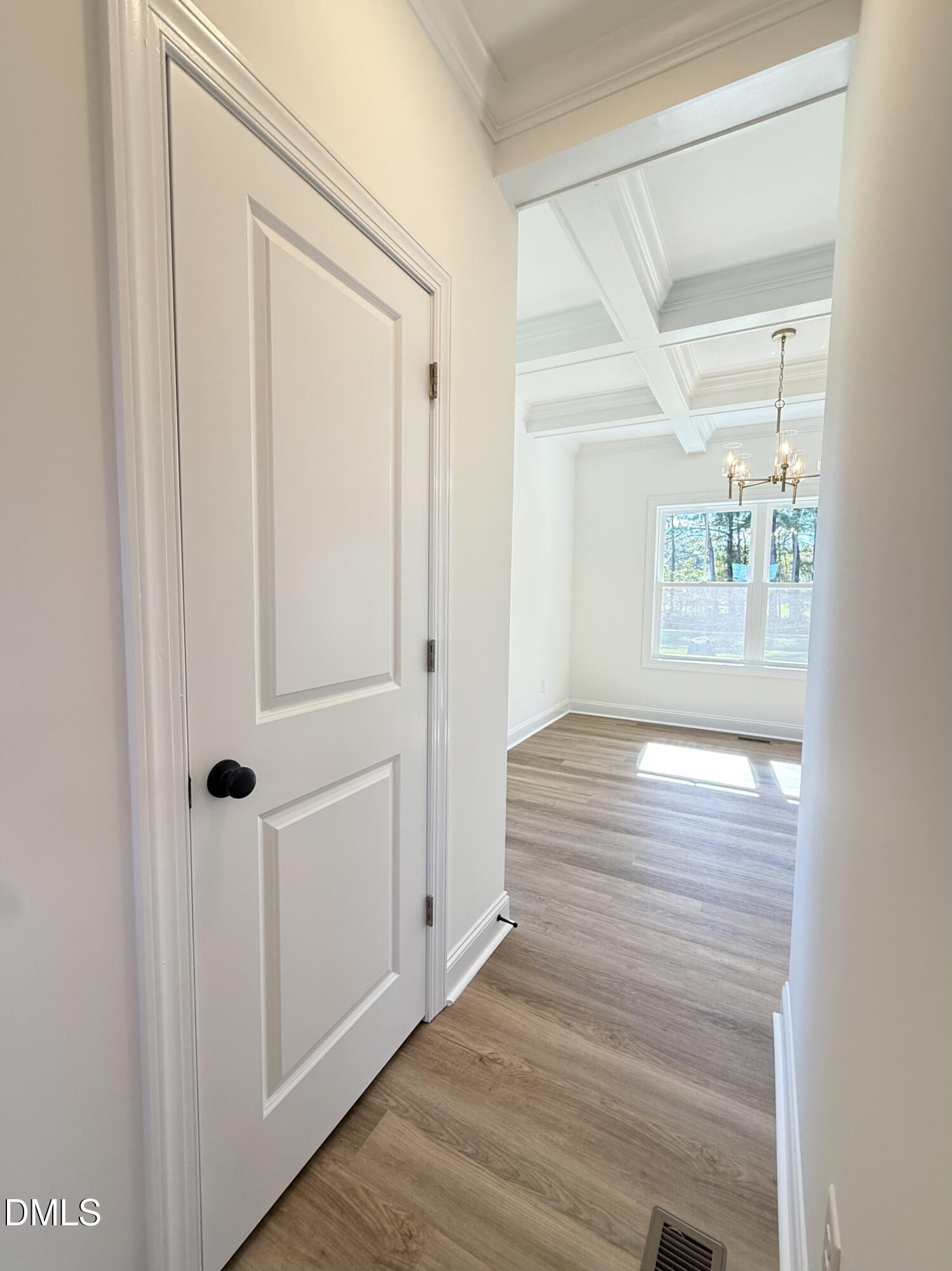 6800 Fire Tower Road Spring Hope, NC 27882 - Photo 11 of 36 an empty room with wooden floor and windows