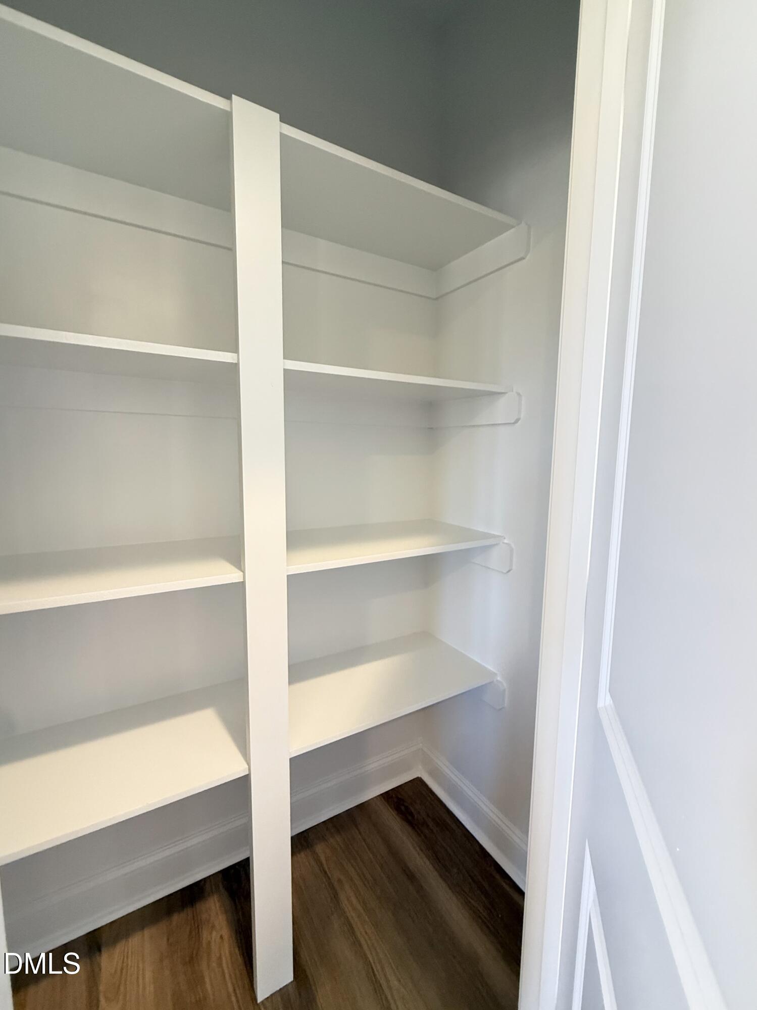 6800 Fire Tower Road Spring Hope, NC 27882 - Photo 12 of 36 a view of walk in closet with empty racks