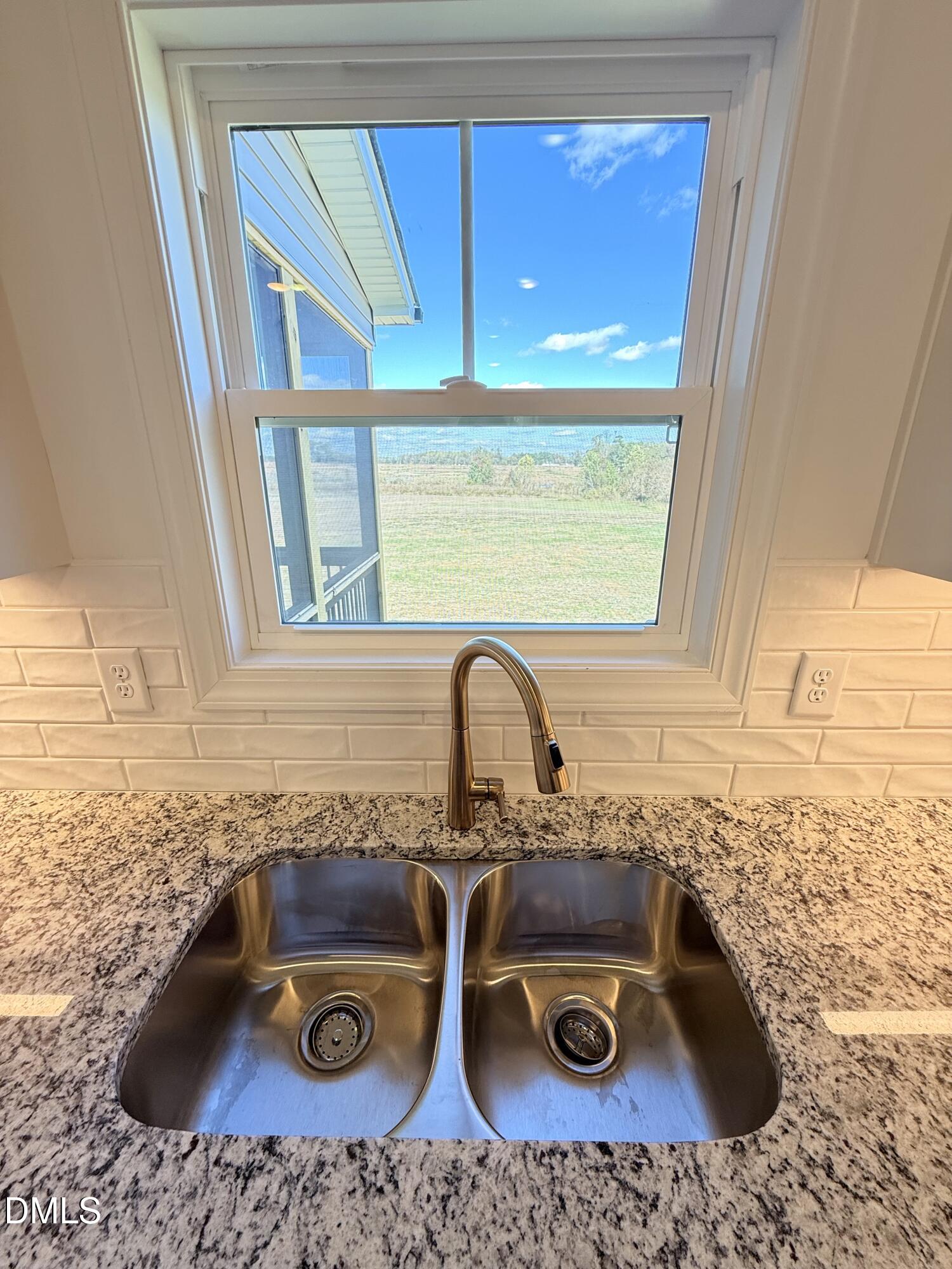 6800 Fire Tower Road Spring Hope, NC 27882 - Photo 13 of 36 a sink a stove a faucet a sink and a window
