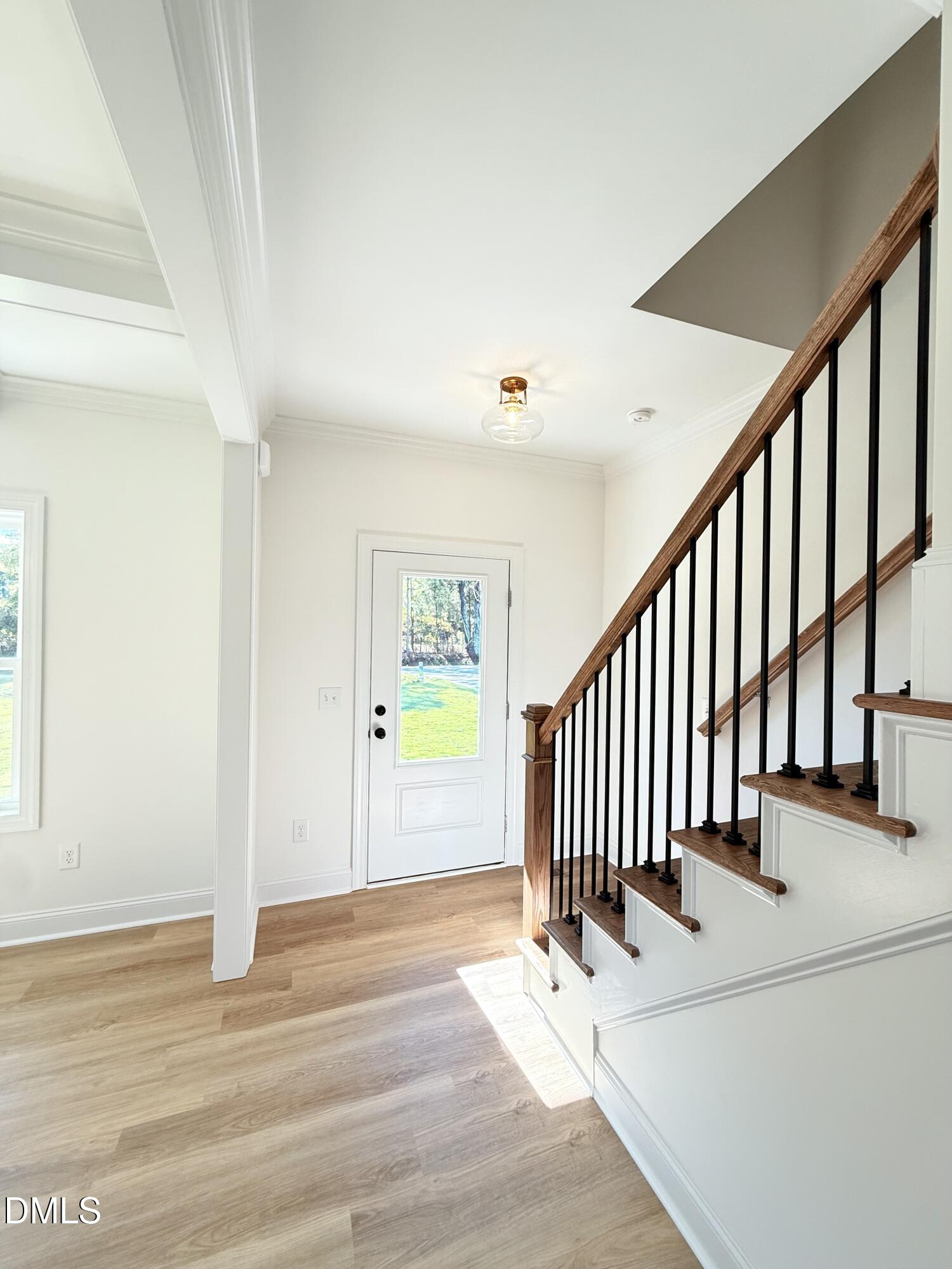 6800 Fire Tower Road Spring Hope, NC 27882 - Photo 2 of 36 a view of a hallway with a room and wooden floor