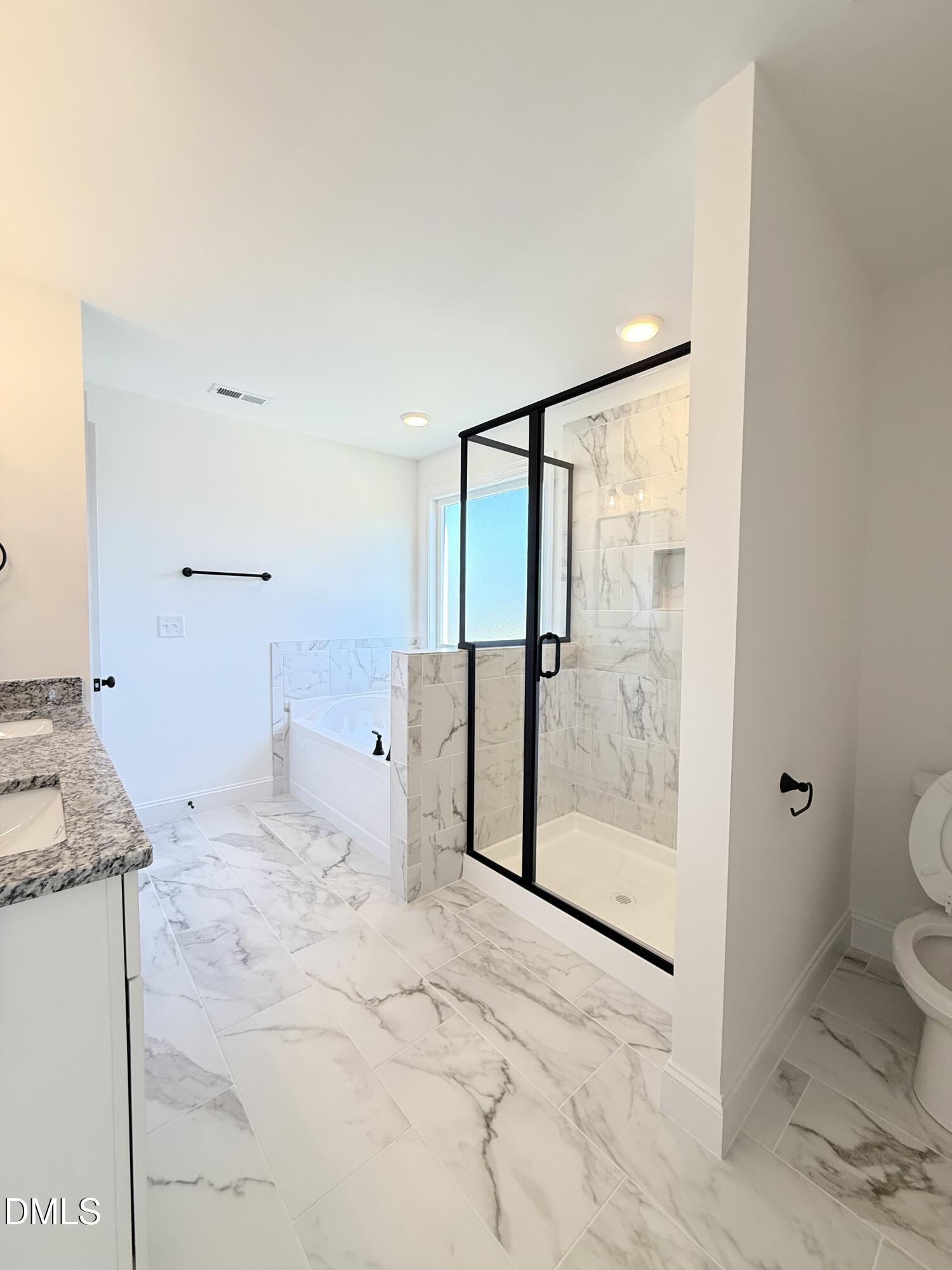 6800 Fire Tower Road Spring Hope, NC 27882 - Photo 26 of 36 a bathroom with a granite countertop sink a toilet and shower