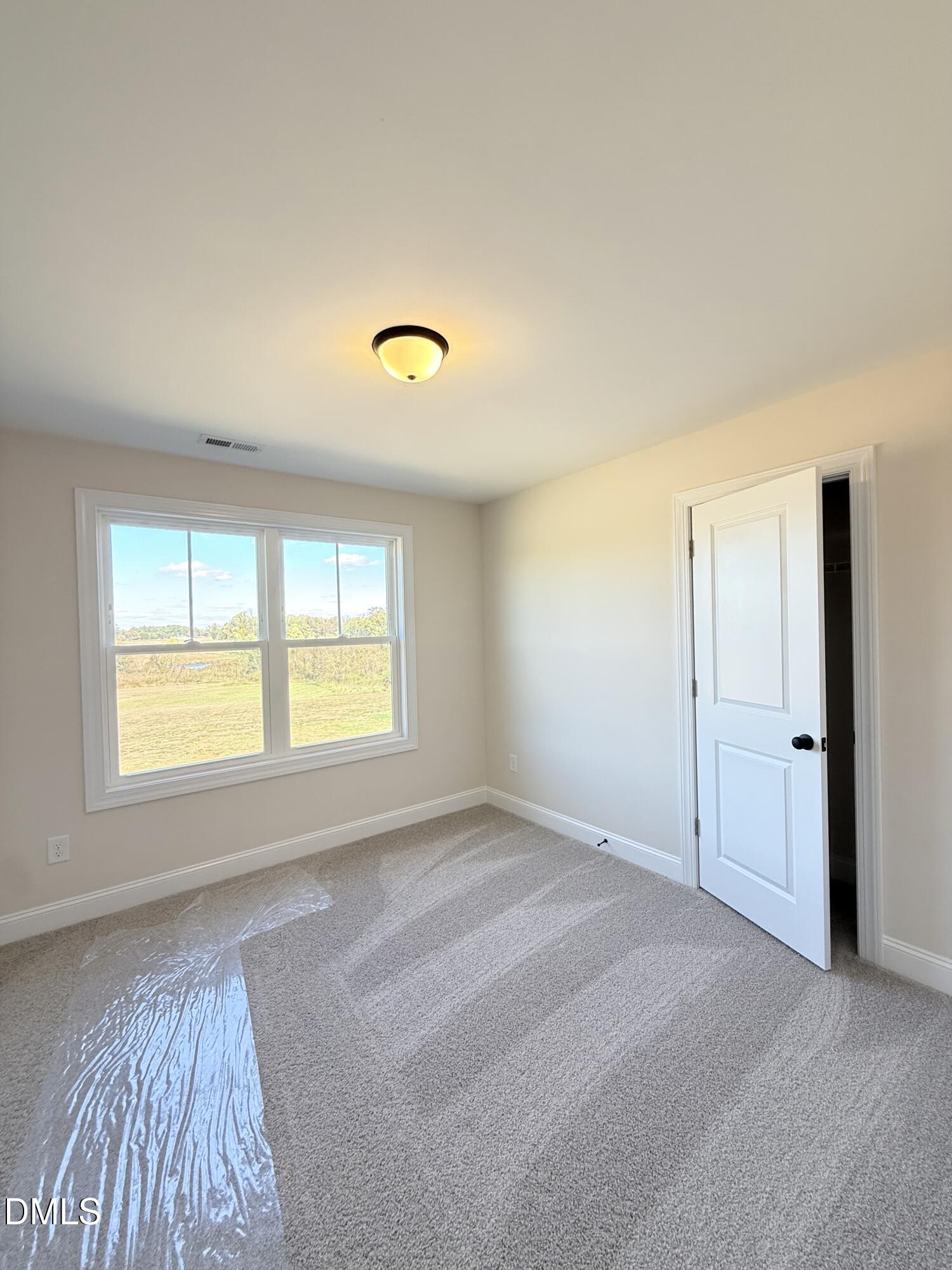 6800 Fire Tower Road Spring Hope, NC 27882 - Photo 27 of 36 a view of an empty room with a window