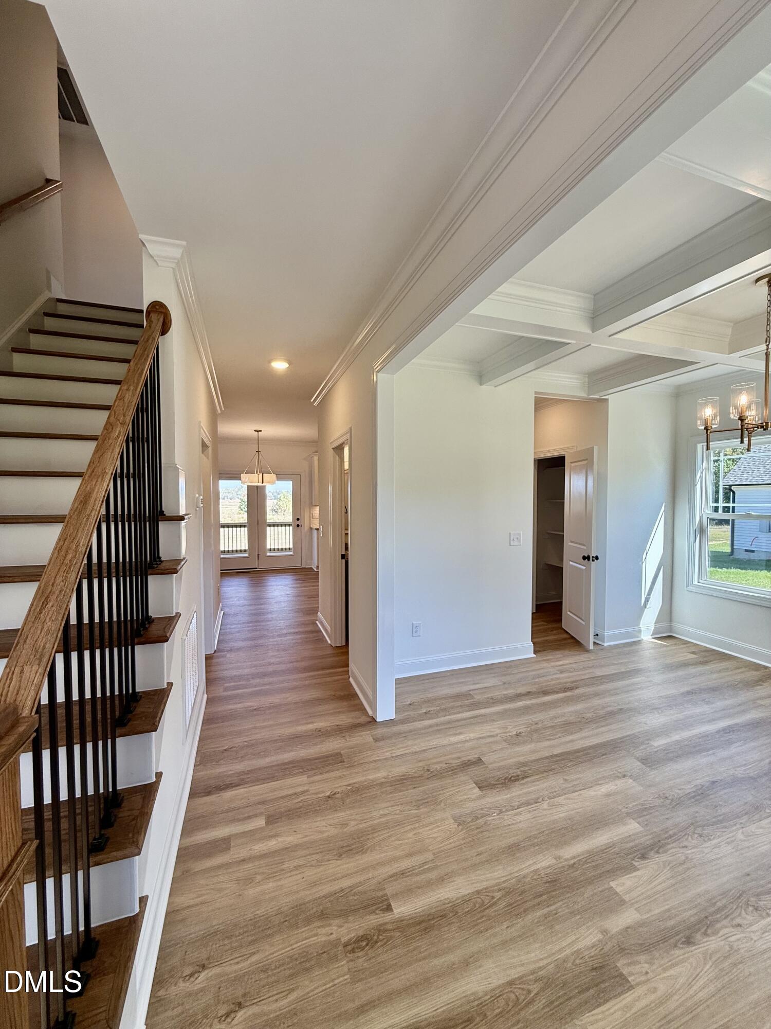 6800 Fire Tower Road Spring Hope, NC 27882 - Photo 3 of 36 a view of a hallway with wooden floor and staircase