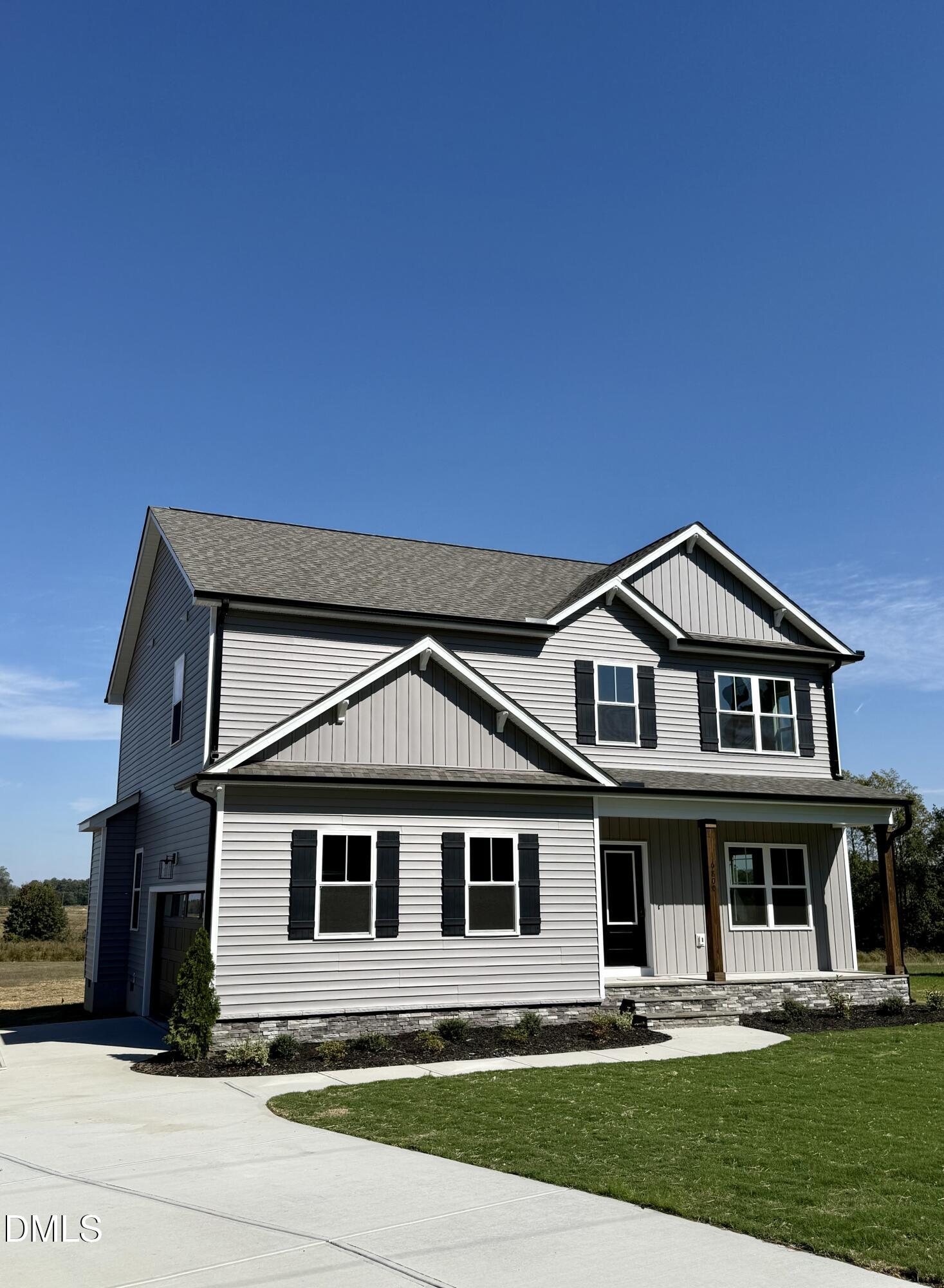 6800 Fire Tower Road Spring Hope, NC 27882 - Photo 32 of 36 a front view of a house with a yard