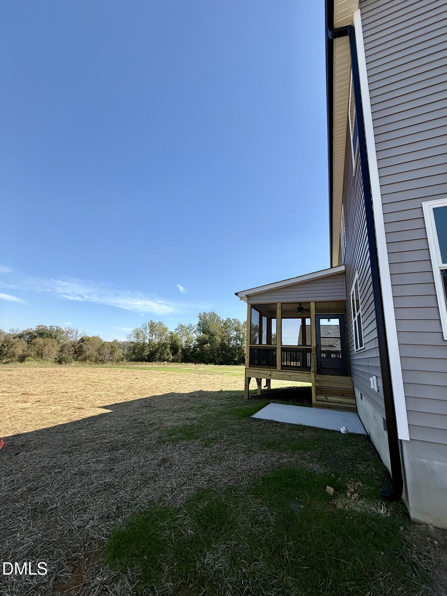 6800 Fire Tower Road Spring Hope, NC 27882 - Photo 33 of 36 a view of a patio with a table and chairs under wooden roof with potted plants