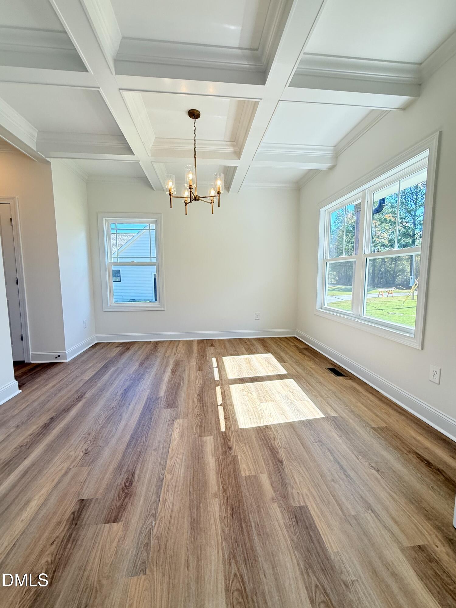 6800 Fire Tower Road Spring Hope, NC 27882 - Photo 4 of 36 wooden floor in an empty room with a window