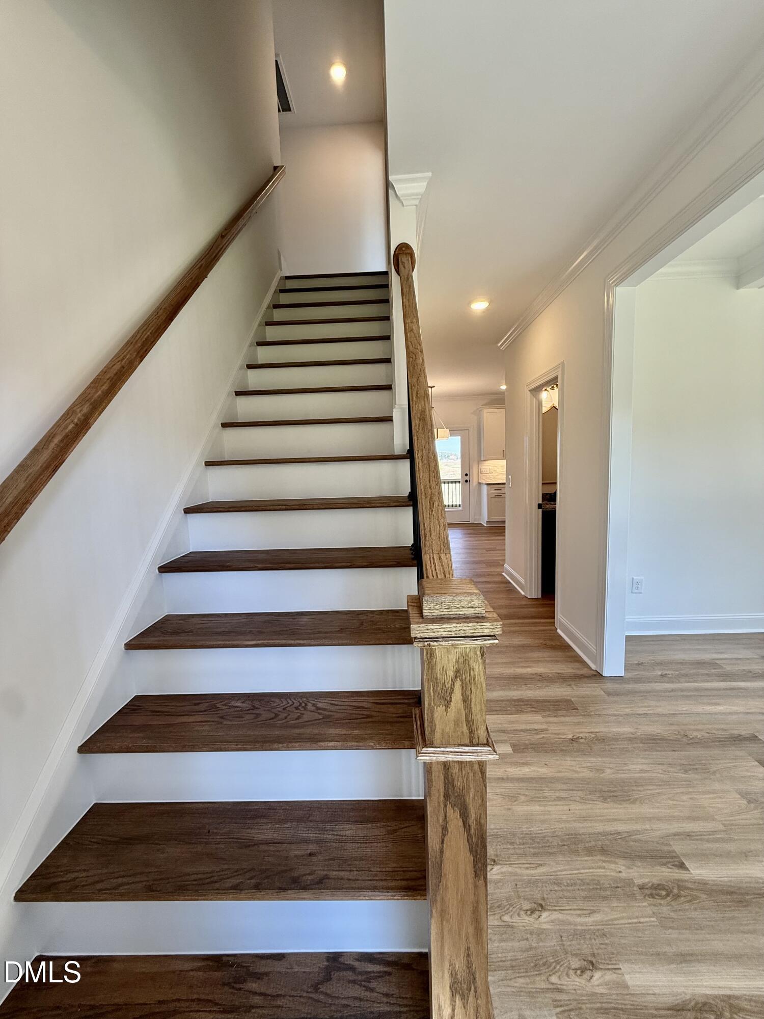 6800 Fire Tower Road Spring Hope, NC 27882 - Photo 6 of 36 a view of entryway and hall with wooden floor
