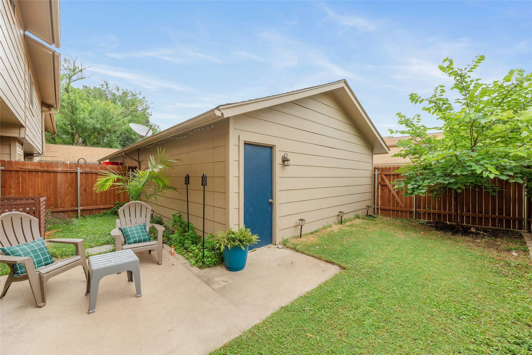 8925 North Plaza, Unit 69 Austin, TX 78753 - Photo 2 of 29 View of outbuilding with a fenced backyard