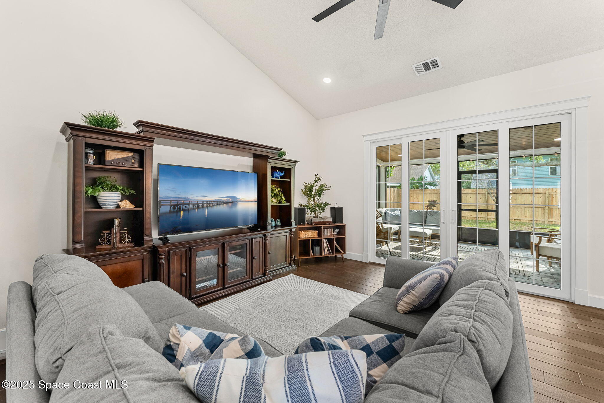 2525 Forest Run Drive Melbourne, FL 32935 - Photo 12 of 36 a living room with furniture and a flat screen tv