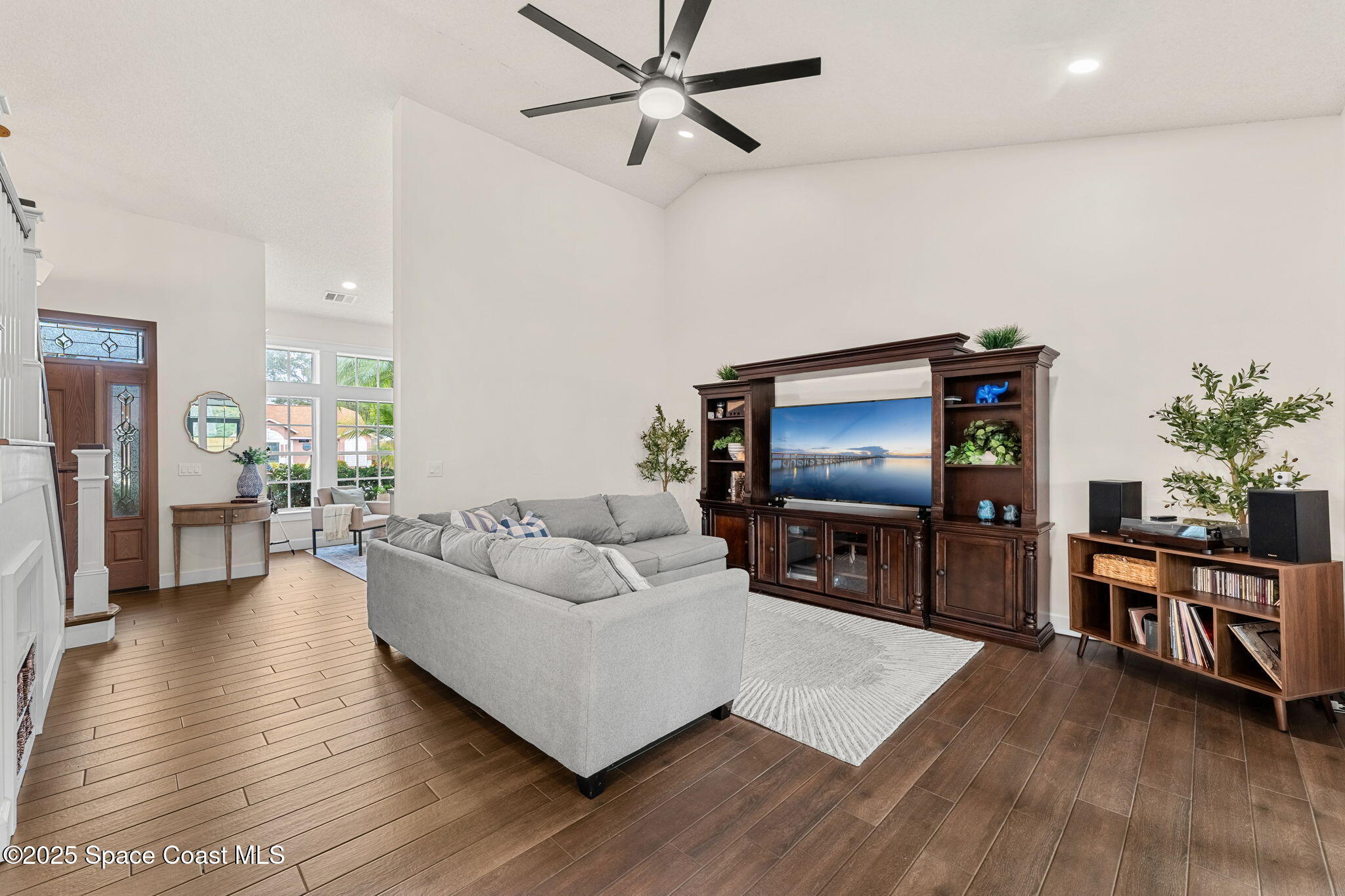 2525 Forest Run Drive Melbourne, FL 32935 - Photo 14 of 36 a living room with furniture and a flat screen tv