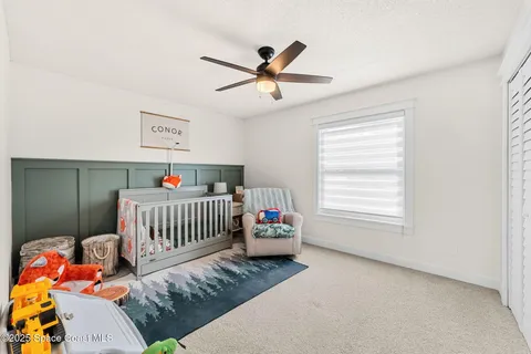 a bedroom with furniture and a window