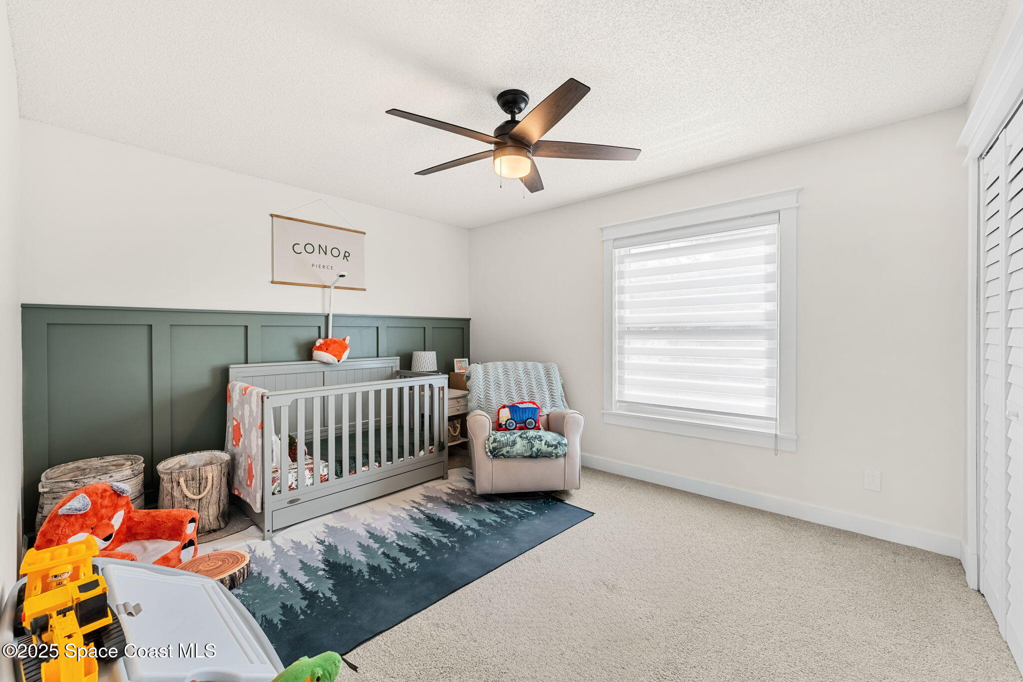 2525 Forest Run Drive Melbourne, FL 32935 - Photo 19 of 36 a bedroom with furniture and a window