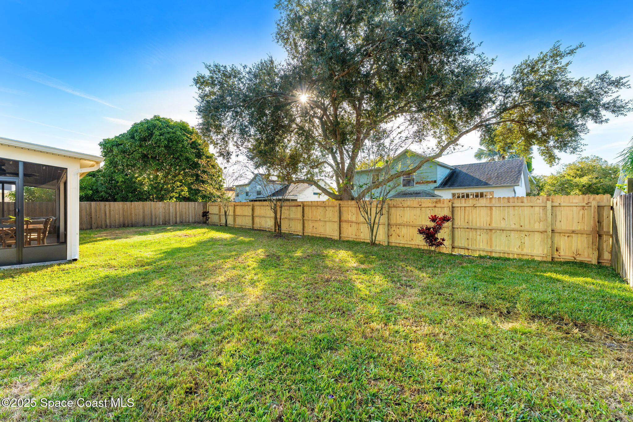 2525 Forest Run Drive Melbourne, FL 32935 - Photo 30 of 36 a view of backyard with wooden fence