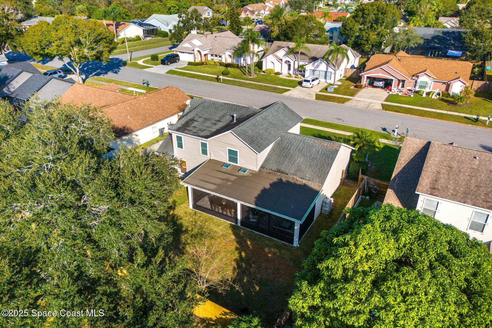 2525 Forest Run Drive Melbourne, FL 32935 - Photo 31 of 36 an aerial view of a house with swimming pool and ocean view