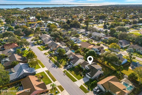 an aerial view of residential houses with outdoor space